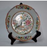 A Double Peacock, famille rose plate with foliate rim, presumably from a similar service to that