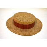 A 1930s woven straw school/college boater hat with penned names of wearers inside, retailed by