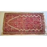 An old Anatolian rug, mid red ground, 1.85 x 1.0 m
