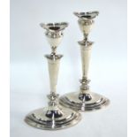 A pair of Adam-style loaded silver baluster candlesticks of eliptical form, Thomas Bradbury & Sons
