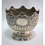 An Edwardian silver rose bowl in the form of a Georgian Monteith, with half-reeding and fluting