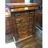 A Victorian rosewood miniature Wellington chest of six even drawers, each with turned pulls raised