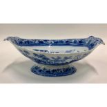 A 19th century blue transfer printed pearlware oval twin handle bowl raised on an oval pedestal