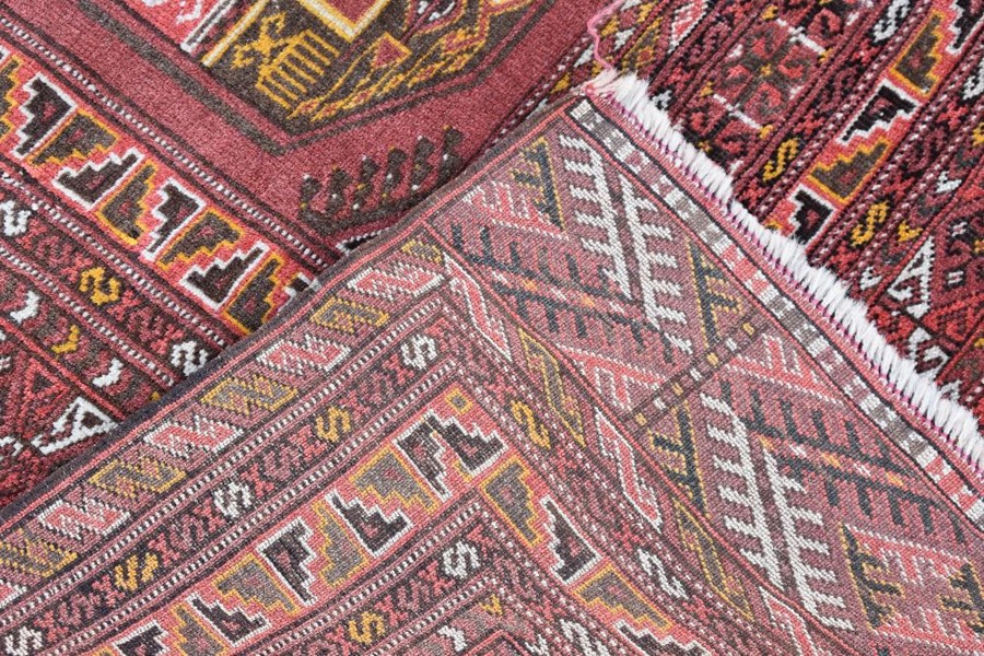 An old Afghan/Uzbek Turkmen rug, circa 1920, the triple gul design on red-brown ground, 195 x 133 cm - Image 6 of 9