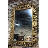 A good and large, 19th century giltwood and gesso rococo mirror frame, the pierced vine leaf