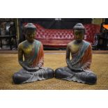 A pair of wood figures of Sakyamuni; each one wearing dhoti, and seated in dhyanasana with their