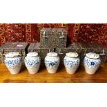 An associated set of five similar blue and white vases, similar to the preceding lot; each one