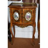 A pair of 20th century gilt metal and porcelain plaque mounted French side cabinets, the pierced 3/4