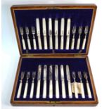 An oak cased set of twelve each silver fruit knives and forks with mother-of-pearl handles, R. F.