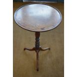 A 19th century mahogany tripod table with circular moulded rim, 44.5 x 71 cm high