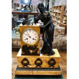 A 19th century French Empire patinated bronze mounted Sienna marble mantel clock, the 8-day two