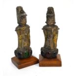 A pair of Asian copper figures of deities, set with semi-precious stones and bosses, 14 cm high (