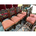A set of six Victorian carved walnut dining side chairs, with red overstuffed seats in the 17th