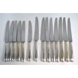 A set of eight OEP table knives with loaded silver handles and stainless steel blades, to/w six