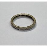 A diamond set full eternity ring, unmarked, size N, approx 2.2g all in