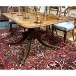 A 19th century mahogany breakfast table, the rectangular tilt top over a turned support, raised on