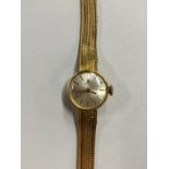 A lady's Tissot 18ct wristwatch with textured mesh bracelet strap, 16.3 g gross weight, London 1965