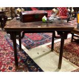 An antique Chinese elm table, the rectangular top raised on four turned legs, 99 cm x 76 cm x 83