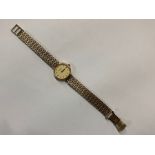 A lady's 9ct Rotary wristwatch with champagne dial and brick-link bracelet strap, 19.6 g gross