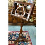 A Victorian rosewood duet music stand, the rise and fall stem with adjustable easels and a folding