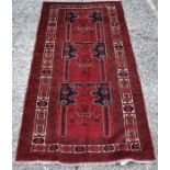 An Afghan Kizil Ayak multi niche prayer rug, circa 1920, the triple Miharb design with burgundy