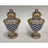 A pair of 19th century Louis XV style Sevres porcelain vases and covers, gilded female mask handles,