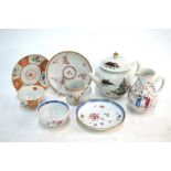 Five items of Chinese Export Porcelain, comprising: a teapot and domed cover; a famille rose, milk