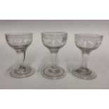 A set of three 18th century cordial glasses, each having a drawn cup bowl simply engraved, plain