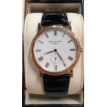 A gentleman's 18 carat gold Patek Philippe Calatrava model wristwatch, small seconds white dial