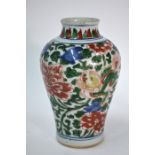 A Chinese Transitional wucai oviform vase, decorated in underglaze blue, orange, green and yellow
