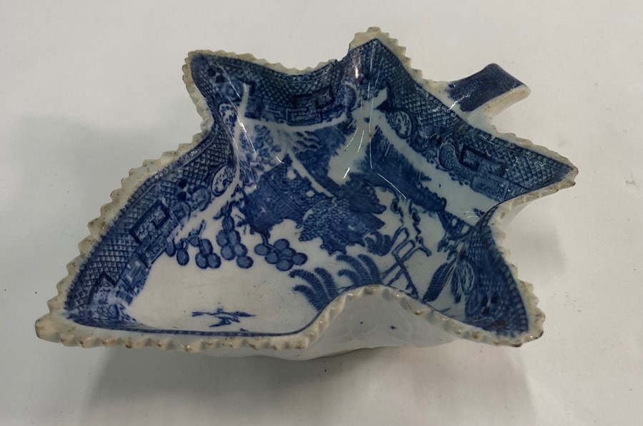 An early 19th century pearlware blue transfer printed willow pattern pickle dish, 13.2 cm longChip - Image 2 of 3