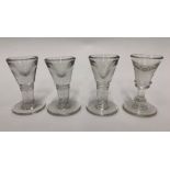 Three Victorian pressed glass penny licks with drawn conical bowls, 9.5 cm high and another