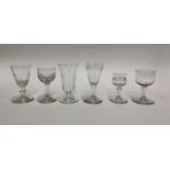 A small collection of 18th/19th century drinking glasses including:  A short ale glass with fluted
