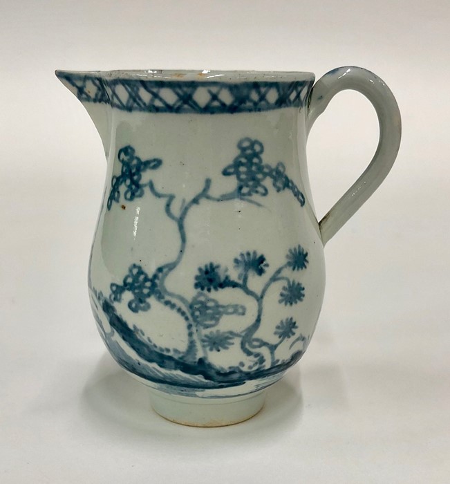 A small 18th century blue and white pearlware jug painted with a Chinoiserie scene with pagoda,
