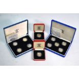 Eleven Royal Mint silver proof one pound coins, in four cases
