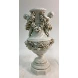 A 19th century Meissen blanc de chine sectional vase raised on a pedestal base with twin handles