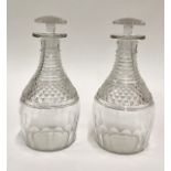 A pair of 19th century decanters of Prussian form with horizontal prismatic cut necks and mushroom