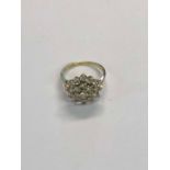 A ballerina style diamond cluster ring, set 9ct yellow gold, size I
