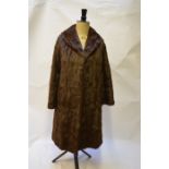 A lady's squirrel fur coat with brown satin lining, 52 cm across chestGood worn condition, small