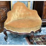A Victorian walnut button-back corner chair on carved cabriole supports