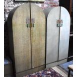 An Art Deco period child's bedroom set comprising two dome top twin door wardrobes, the interiors