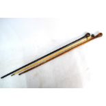 An ivory walking cane with silver pommel, Birmingham 1893 (a/f), to/w two other canes, a vintage