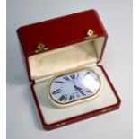 A Cartier travel/desk alarm clock with calendar c.1980s no. 7531-07100 gilt silvered oyster case,