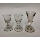 An 18th century cordial glass, conical bowl, blade knop over inverted baluster stem, basal knop,