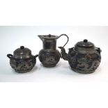 A Chinese pewter mounted service, comprising: teapot, sugar bowl and milk jug. the teapot marked