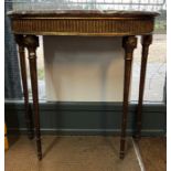 A 19th century demi-lune giltwood console table, the marble top over an a arcade frieze and raised