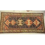 An antique Persian Mahal kellegh carpet, the five rows of lozenges on blue/red ground, 3.65 x 1.68 m