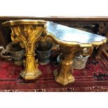 A pair of George III giltwood  console tables of serpentine form, the faux marble painted tops