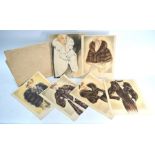 A 1930s Harrods advertising portfolio of seven loose-leaf fashion prints of models in fur coats,