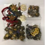 A quantity of assorted military cap badges and other insignia including - 6th V.B. Manchester Regt.;